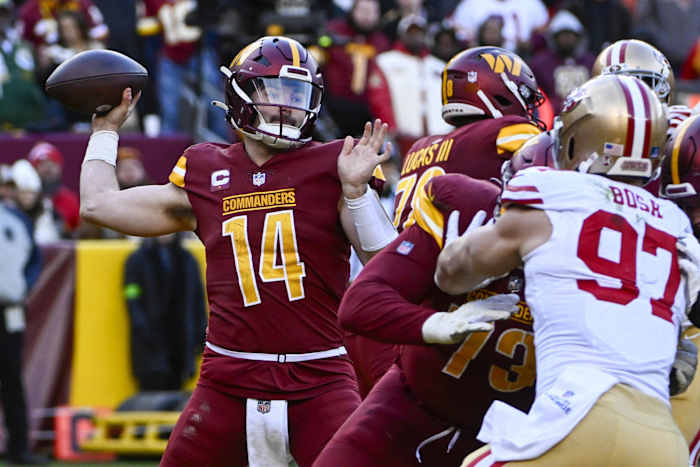 Dec 31, 2023; Landover, Maryland, USA; Washington Commanders quarterback Sam Howell (14) attempts a pass against the San Francisco 49ers during the second half at FedExField.